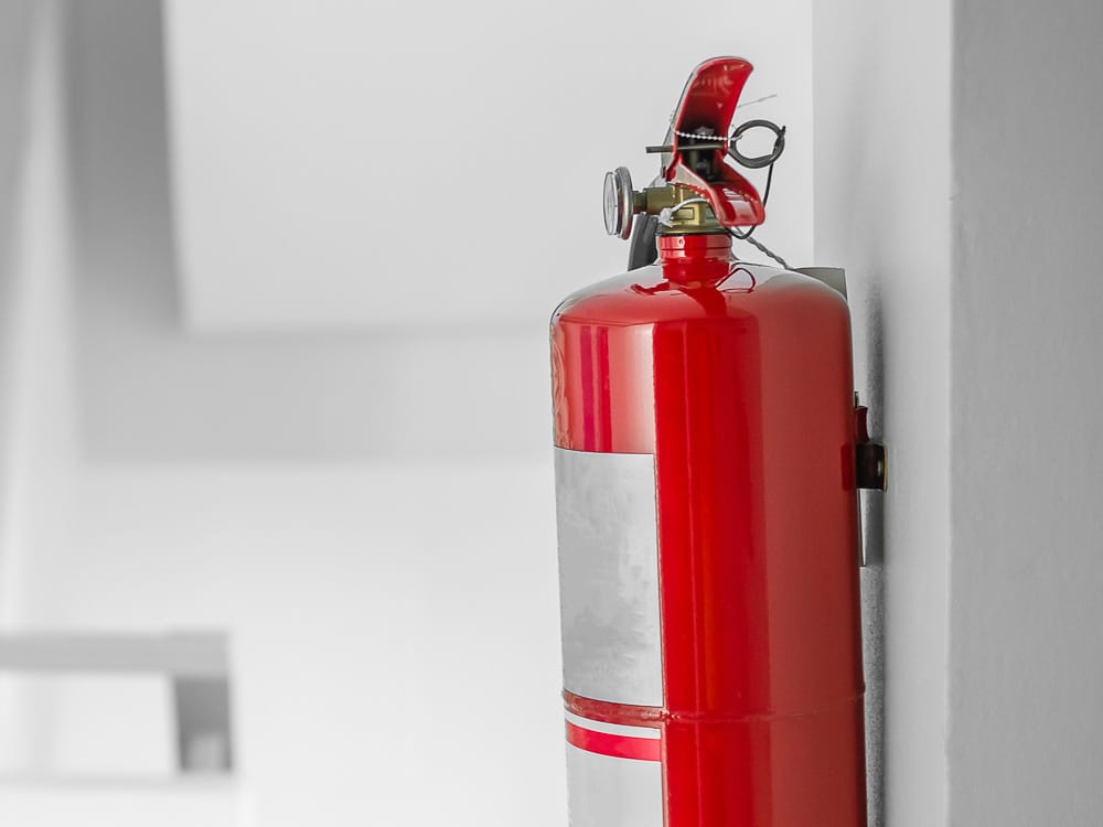 Fire extinguisher system on the wall background, powerful emerge